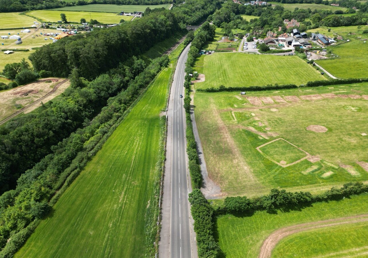 Aerial view along Weston Road at Long Ashton, the road retained by the wall being rebuilt