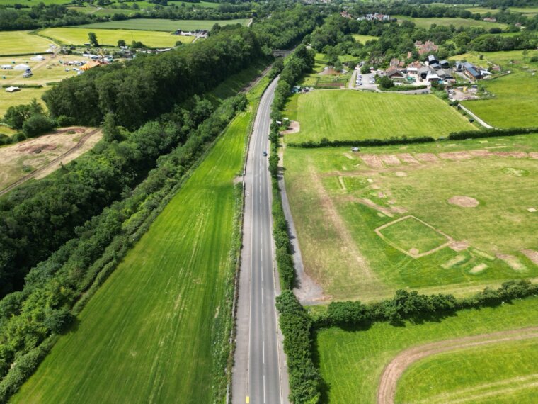 Aerial view along Weston Road at Long Ashton, the road retained by the wall being rebuilt
