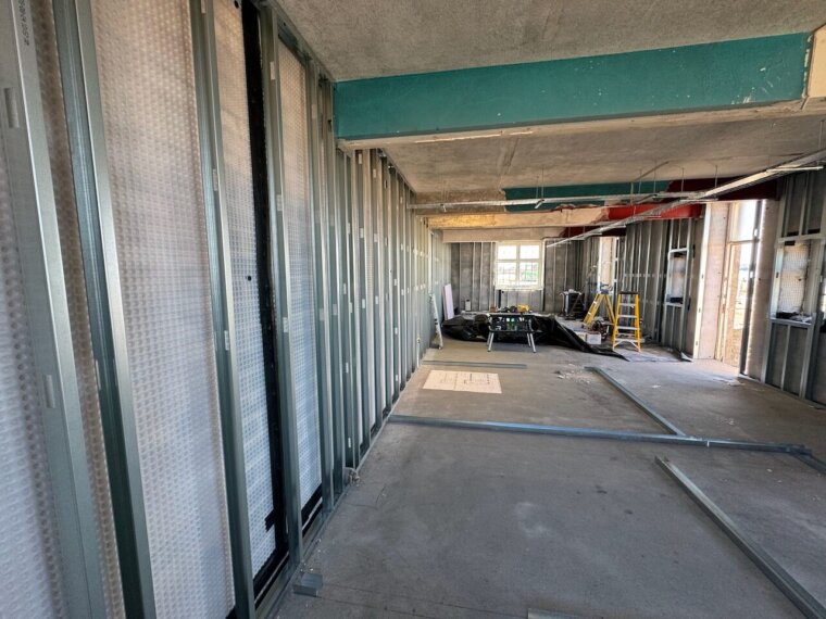 Cavity drain membrane and light steel frame partitions during construction